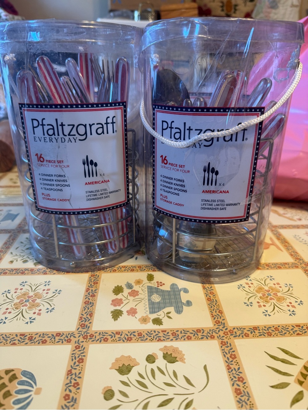 Two unopened packages of Pfaltzgraff Everyday Americana 16-piece flatware sets